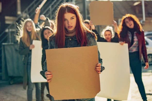 A group of people participating in a peaceful protest, holding signs and banners with slogans promoting social justice. The scene should convey a sense of unity and determination.