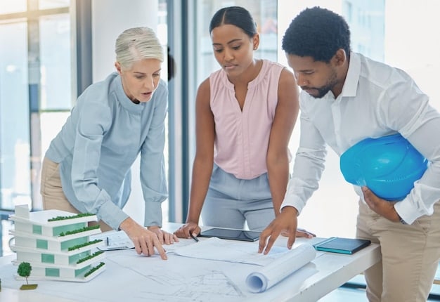 A diverse team in hard hats reviewing blueprints for a sustainable building project, emphasizing collaboration and forward-thinking approaches to meet new environmental protection requirements.