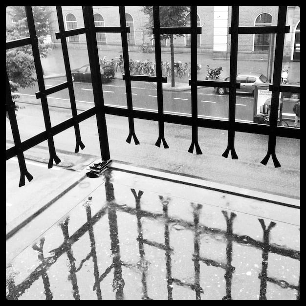 A split image contrasting a crowded prison cell with a well-funded rehabilitation center. The prison cell depicts a bleak and hopeless environment, while the rehabilitation center shows individuals participating in counseling and job training programs.