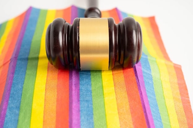A gavel resting on a stack of law books, with the rainbow flag subtly reflected in the background. The image symbolizes the ongoing legal battles and challenges faced by the LGBTQ+ community in the US.