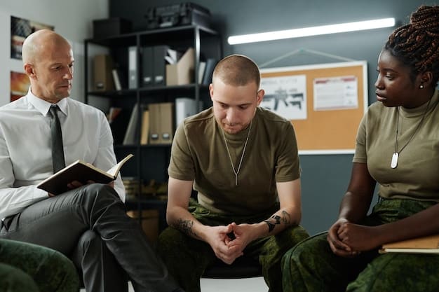 A photograph of a community meeting or workshop focused on hate crime awareness and prevention, showing diverse participants engaging in discussion and learning from each other.