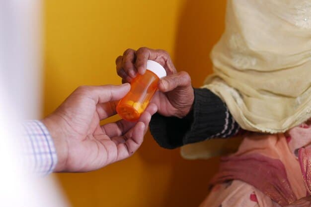 A health worker hands a naloxone kit to a person, with educational materials on overdose prevention in the background.