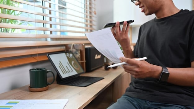 A person meticulously detailing a financial budget on a spreadsheet, with graphs and figures visible, emphasizing accuracy and planning in grant applications.