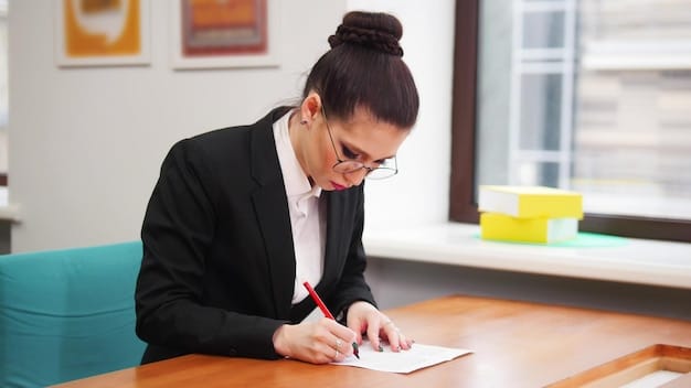 A person sitting at a desk, carefully proofreading a document. They are using a pen to mark corrections and are surrounded by stacks of papers and reference materials. The image represents the importance of thorough review and editing in grant writing.