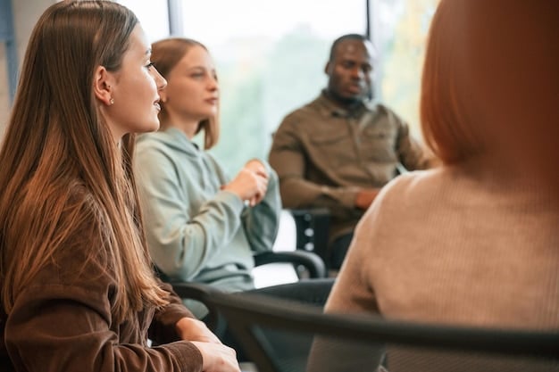 A close-up shot of a diverse group of people listening attentively to a speaker at a community meeting. The speaker is gesturing enthusiastically, and the audience members are engaged and nodding in agreement, highlighting Effective Communication: Reaching Your Target Audience and Raising Awareness for Your Community Action Project in a public forum.