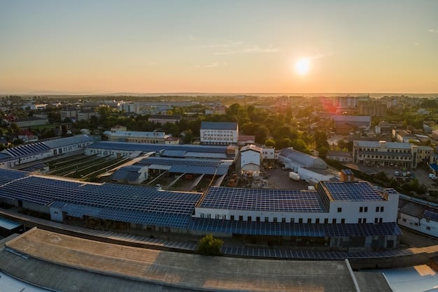 A factory with solar panels on the roof, showcasing a company's investment in renewable energy and sustainable practices. This image illustrates a practical application of CSR and its potential impact on 'Analyzing the Role of Corporations in Addressing Social Justice Issues: Are Corporate Social Responsibility Initiatives Effective?'.