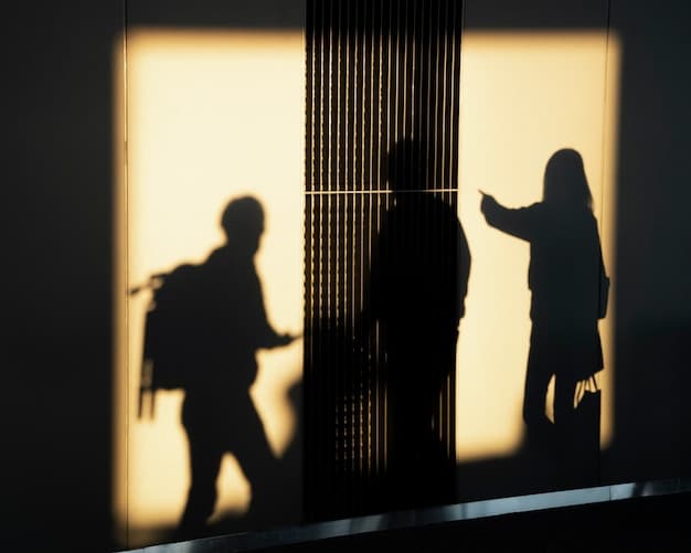 A silhouette of a family visiting an inmate through a glass window, conveying the emotional distance and separation caused by incarceration. The image should emphasize the impact on families and How Does the Prison System Contribute to Social Injustice? Exploring Alternatives to Incarceration in 2025.