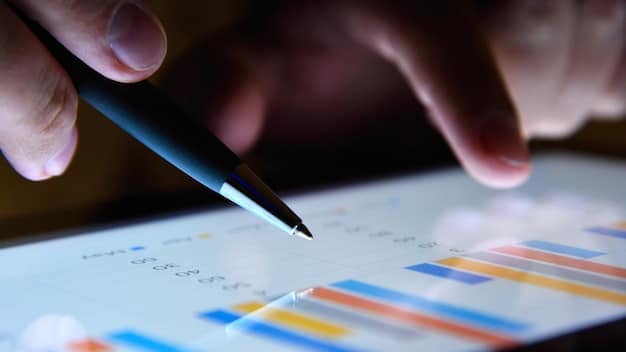 A close-up shot of hands holding a pen, highlighting points on a complex federal grant application form, with blurred charts and graphs in the background indicating data analysis.